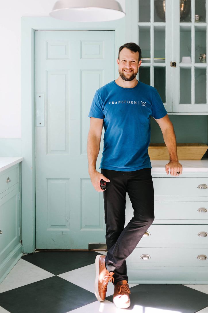Nathan Spearing, founder of Transform NC, in a completed historic kitchen remodel