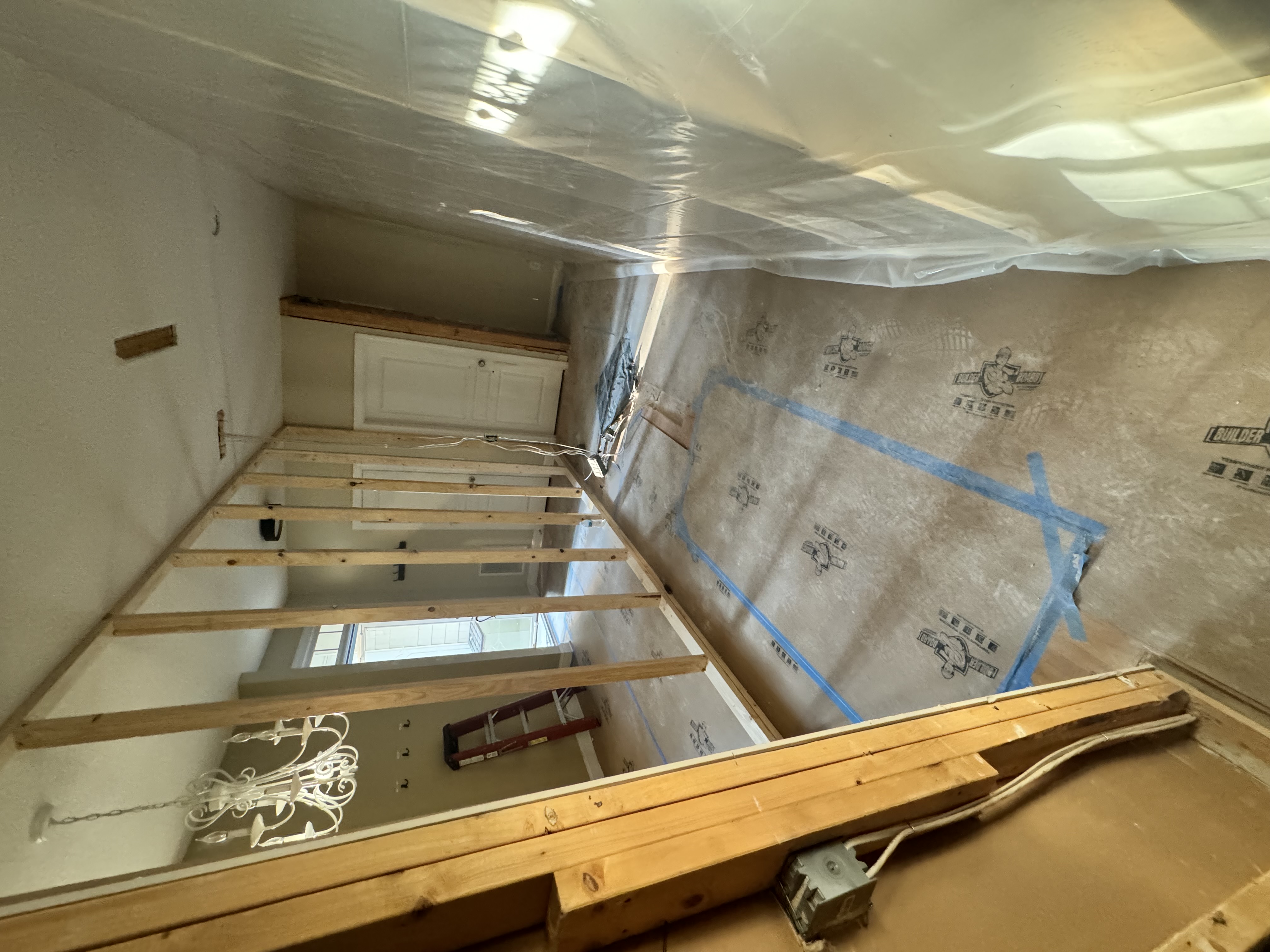 New support wall on main level carrying the attic floor loads