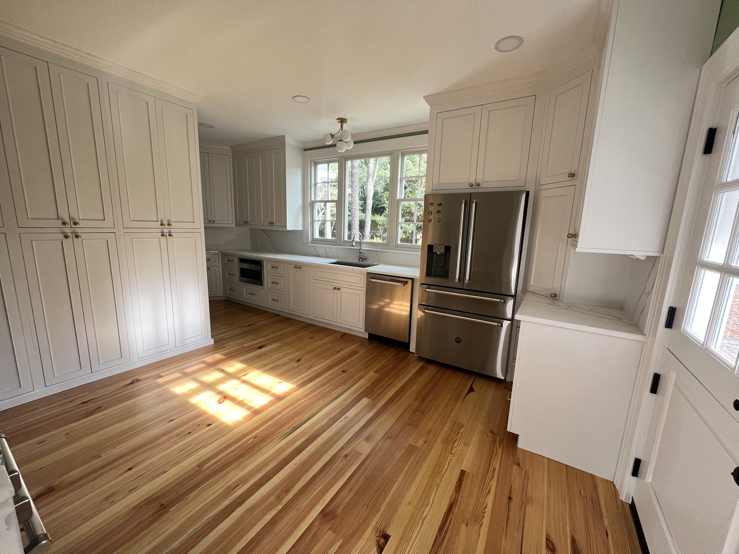 Kitchen island with marble countertops and historic character