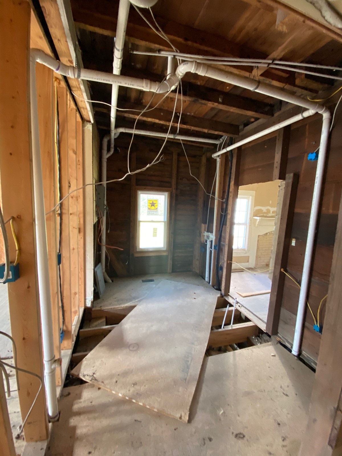 The hall toward the bathroom with the partitions gone. Everything downstairs was going to be rebuilt on new structure