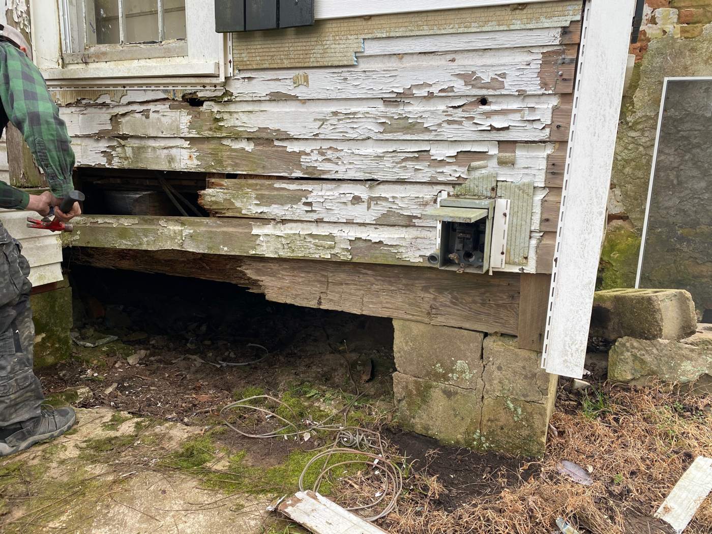 Under the kitchen window. The sill had been sitting on a field stone and the ground for a long time