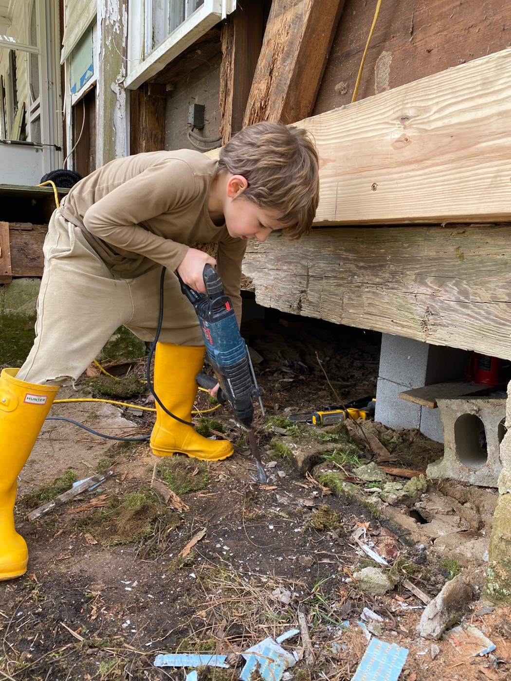 Helping remove the old "foundation" so we can put new footings in place