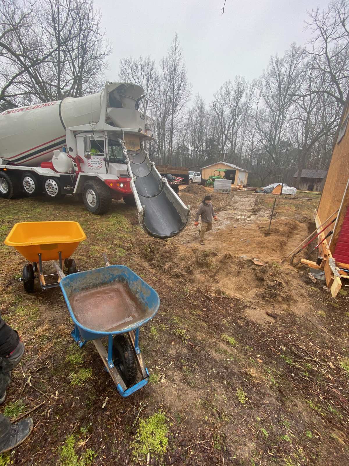 Pour day, in the rain. The concrete for interior footings, came in by a wheelbarrow through the front door