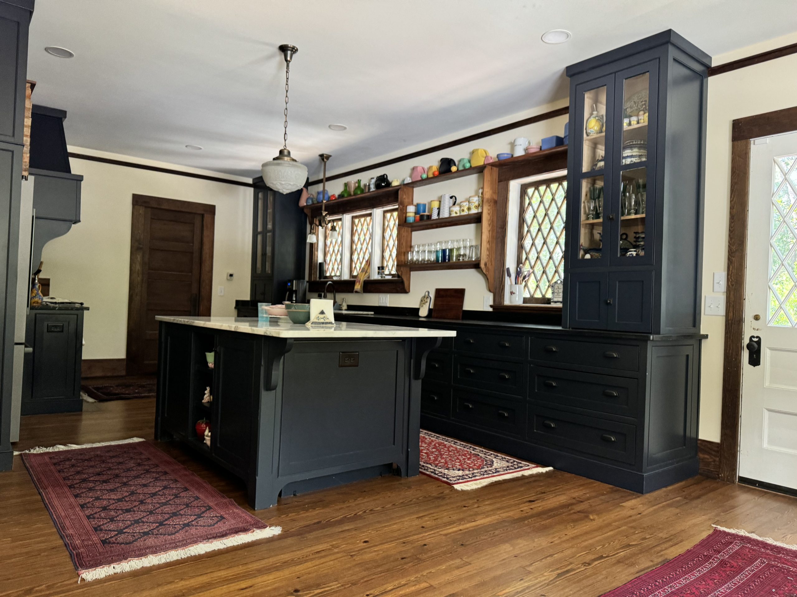 Historic kitchen expansion incorporating former screened porch seamlessly