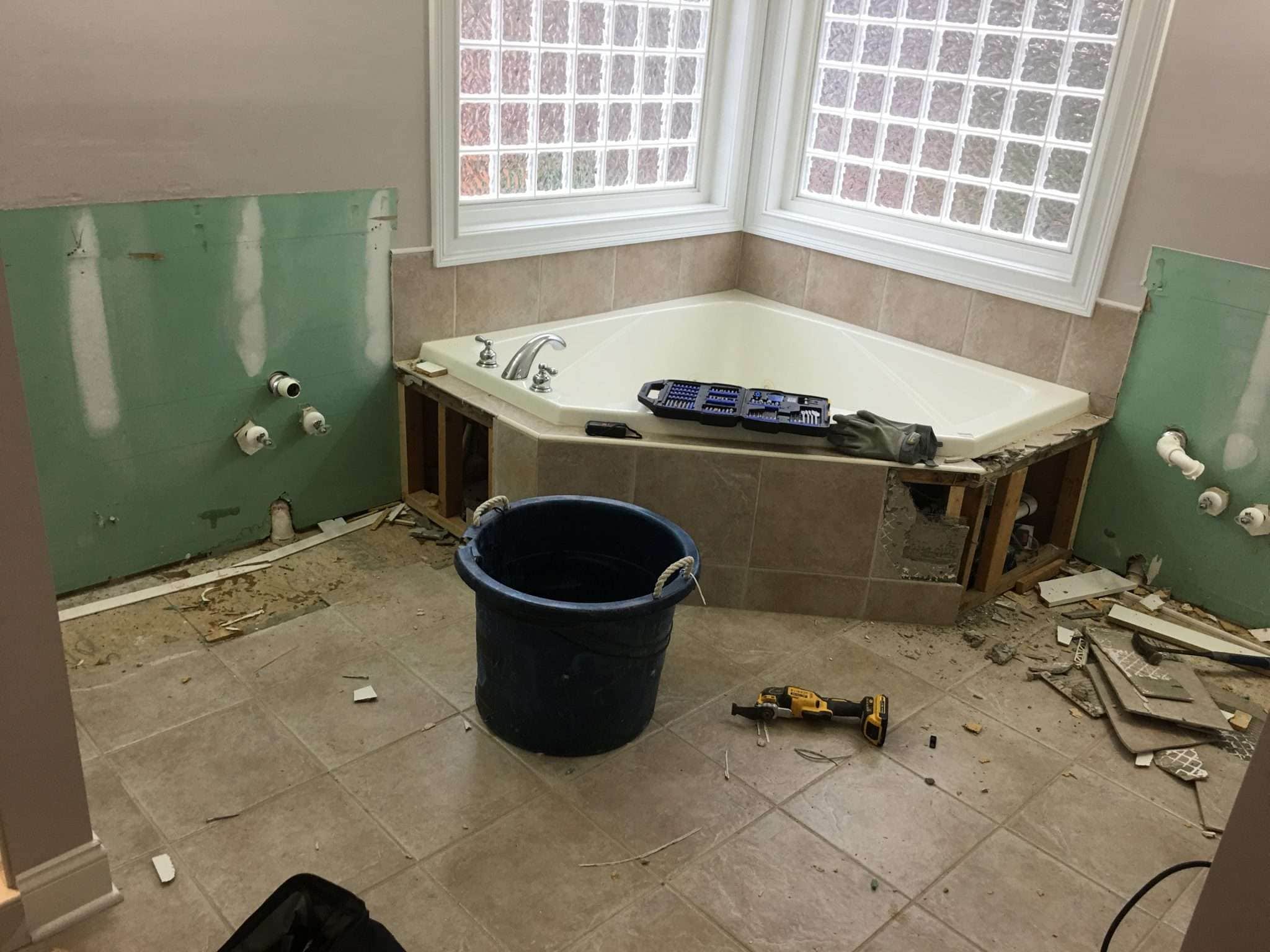 Demolition phase showing bathroom preparation for renovation