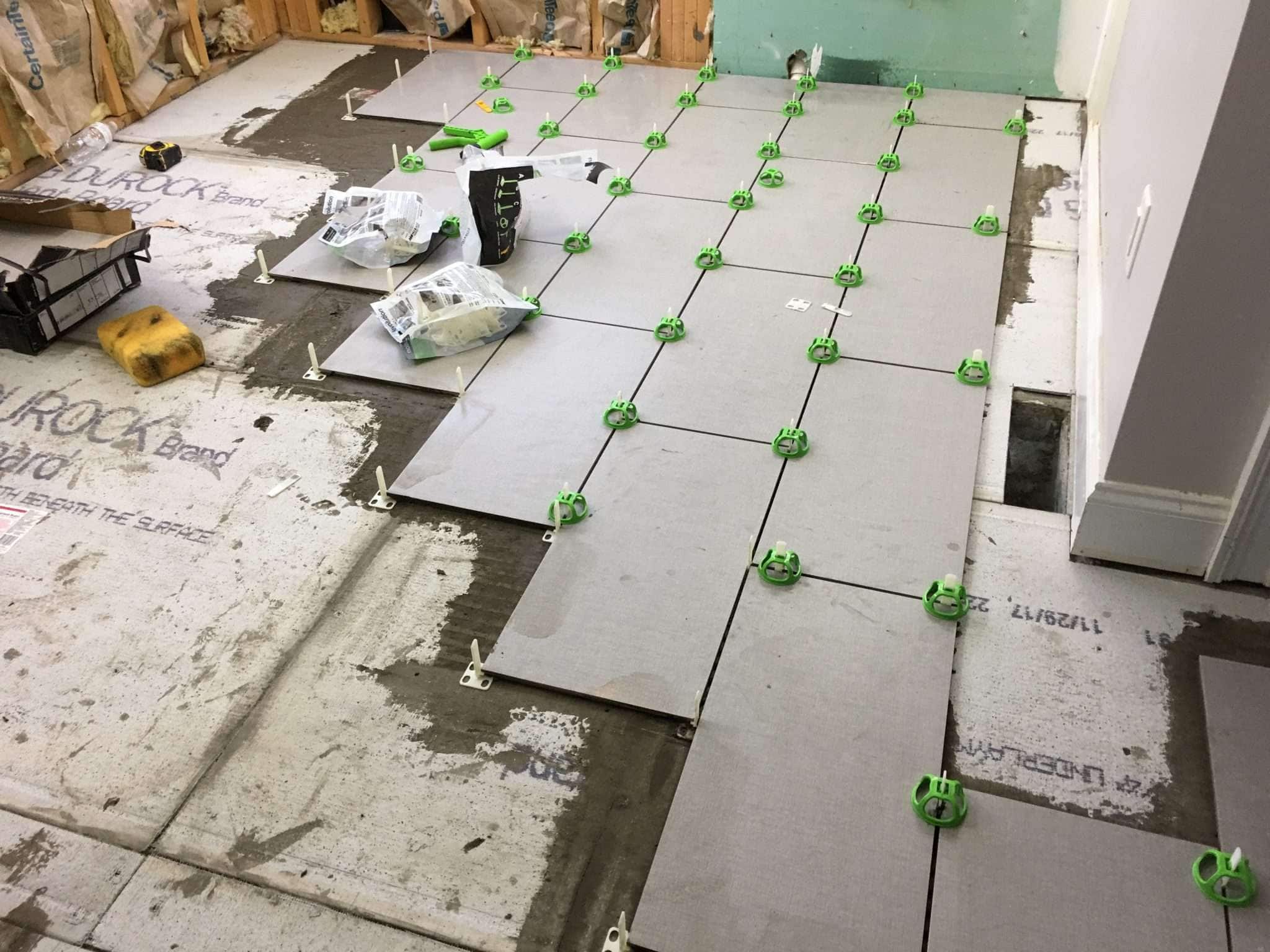 Tile flooring installation and vanity preparation phase