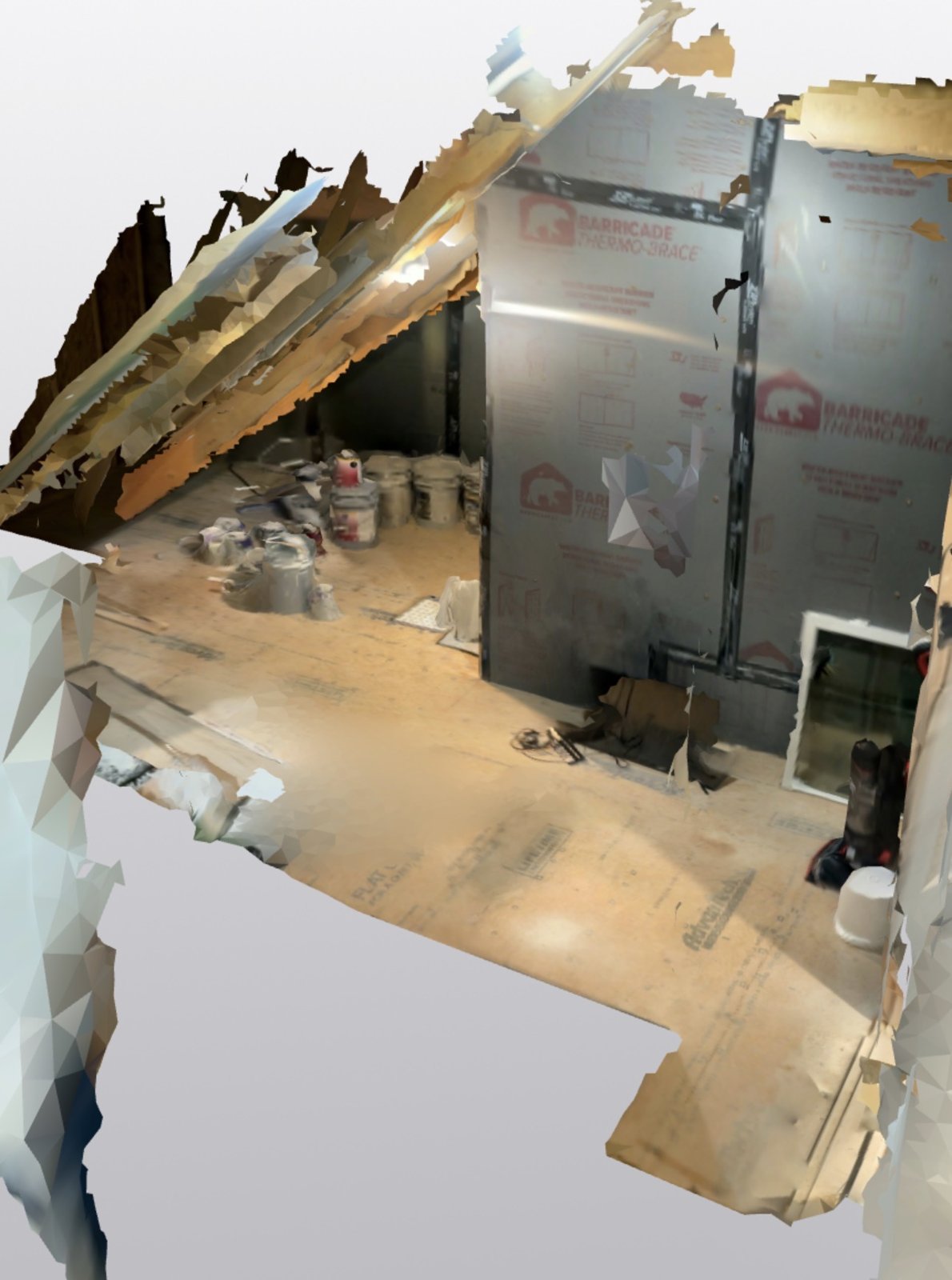 Unfinished attic before work: open rafters, foil-faced insulation board on the walls, plywood floor, supplies stacked in the corner
