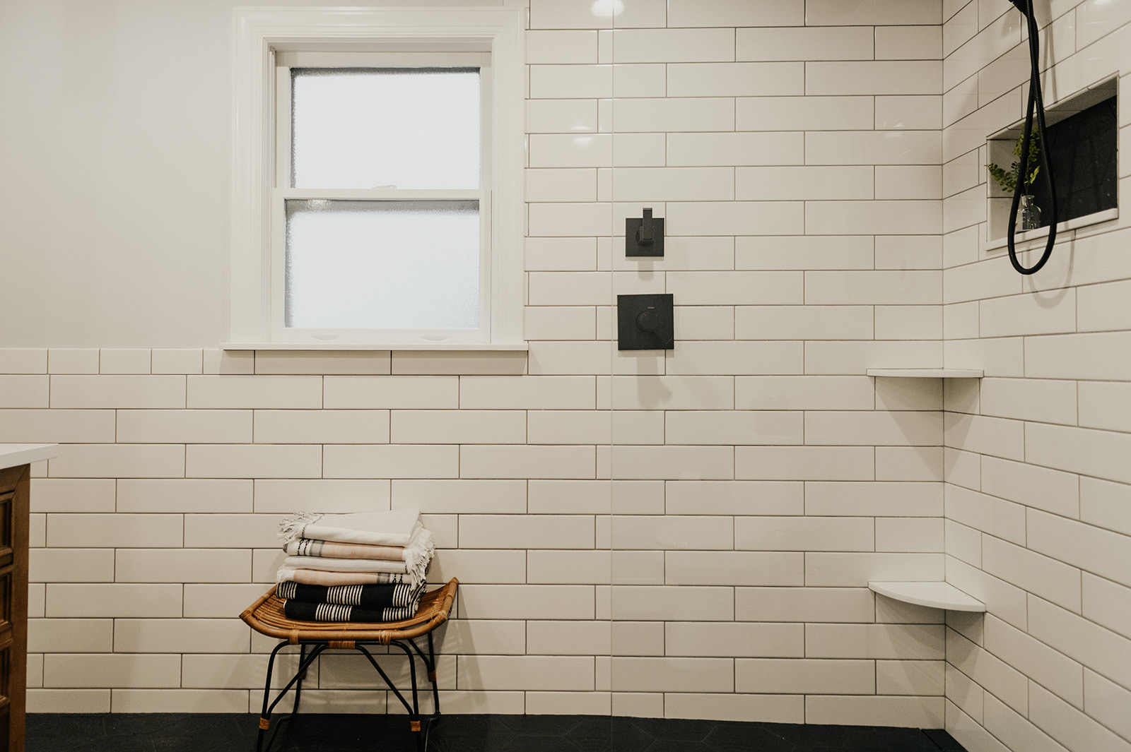 After: detail of the rustic wood vanity drawers with matte black hardware