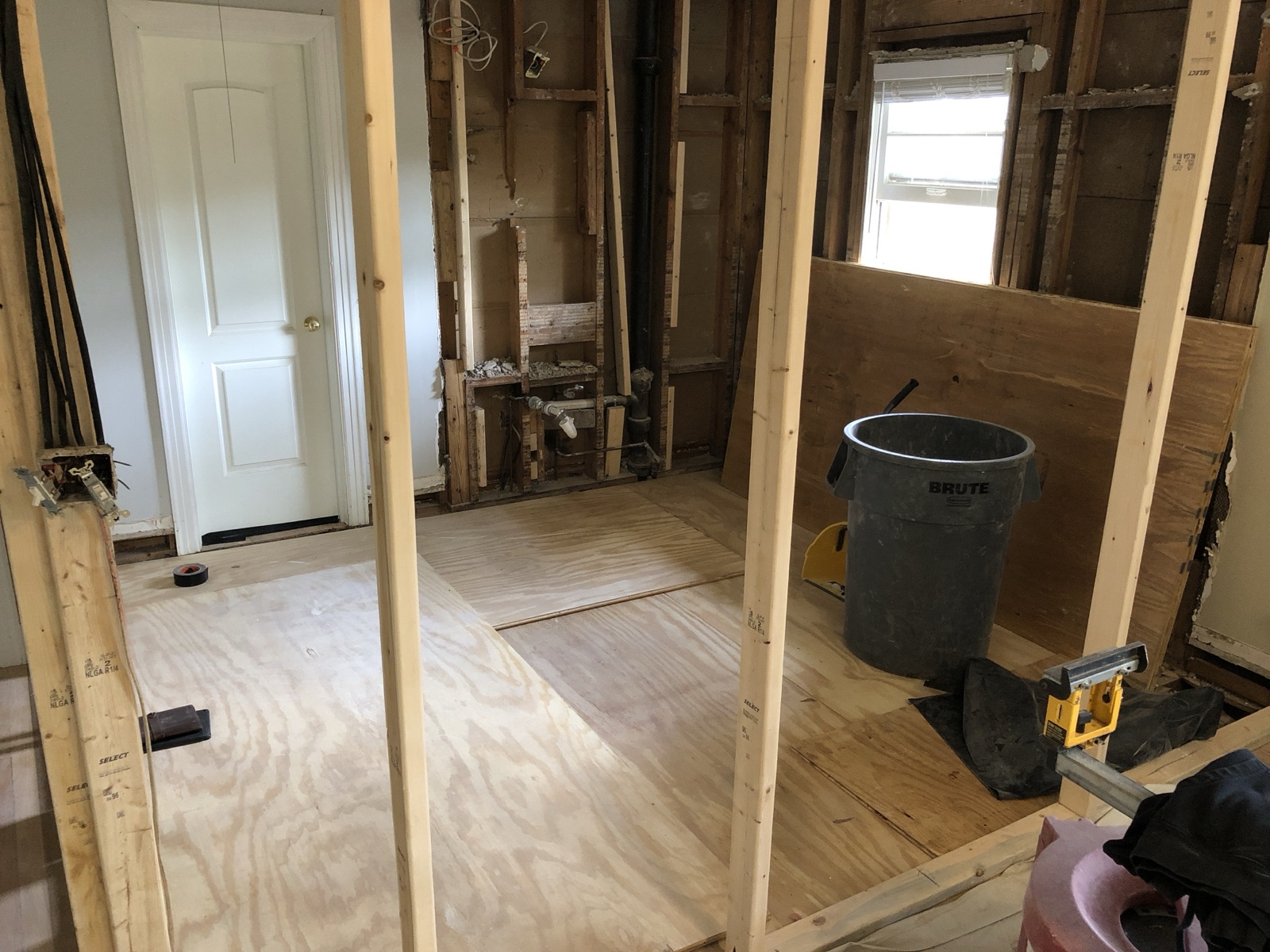 During: framing exposed after gutting the 1950s primary bath down to studs