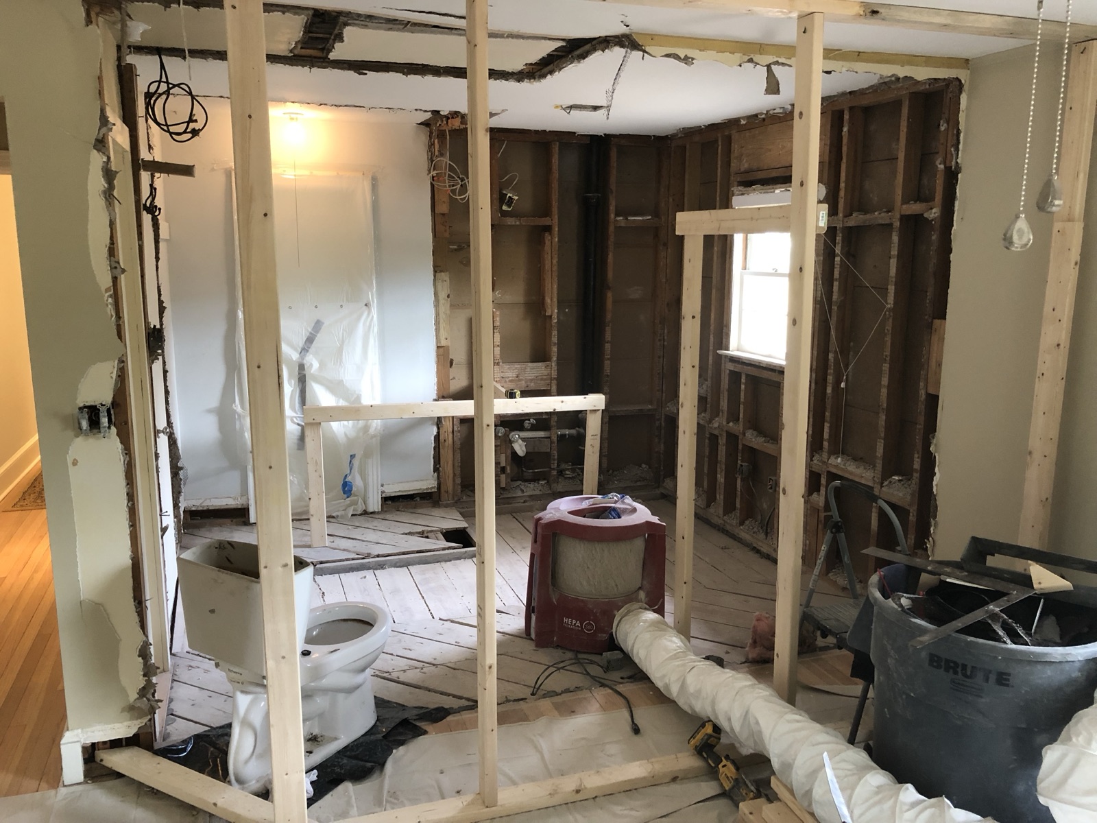 During: Schluter DITRA-HEAT uncoupling and electric radiant floor membrane being laid in the expanded footprint