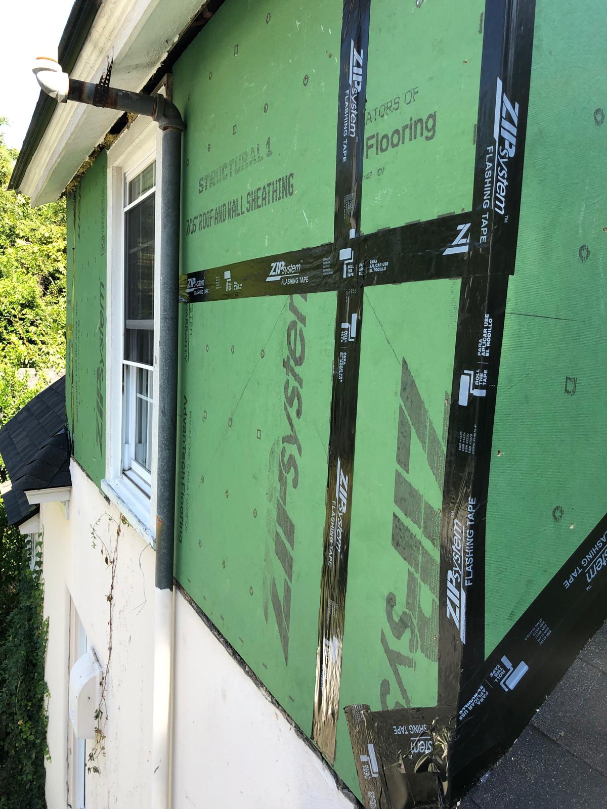 ZIP System sheathing on the dormer with every seam and the window taped before siding